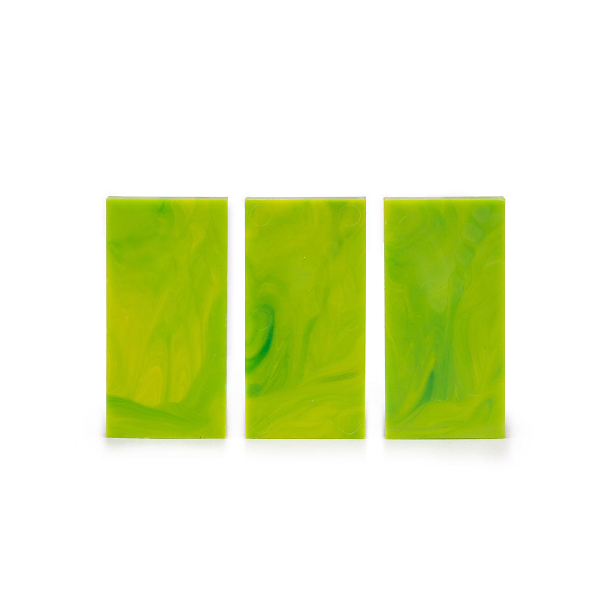 Close-up of three upright Bulk Dominoes Acid Storm Pro Dominoes from Atwood Toys showing the swirled marbled lime green finish.