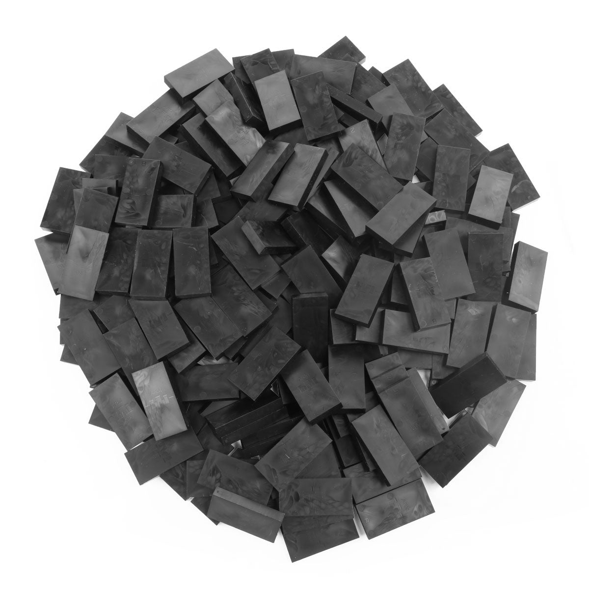 Bulk Dominoes Black Pro Dominoes from Atwood Toys, a top-down pile of solid black full-weight toppling dominoes for chain reactions and domino art.