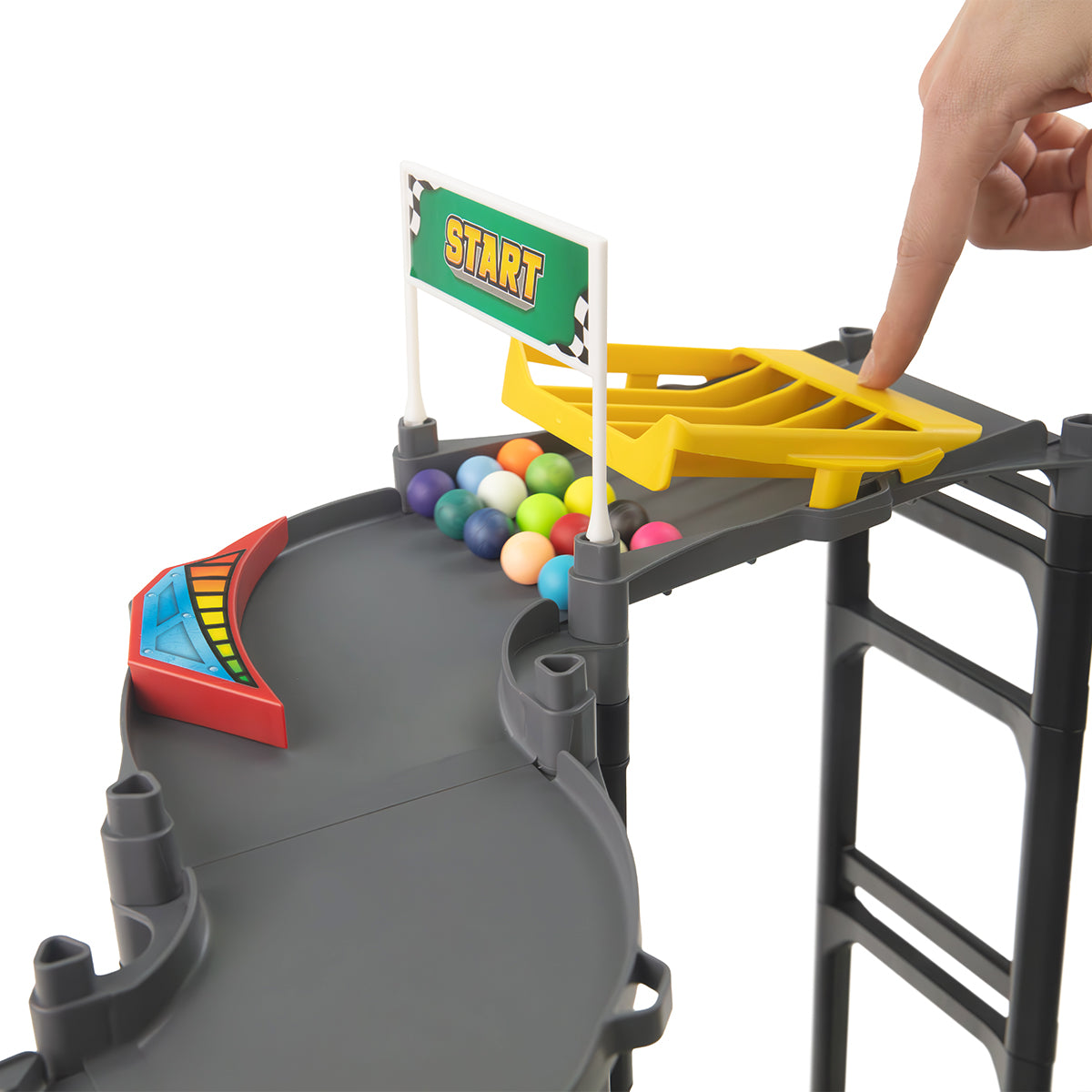 IMR Circuit Redline starting block with start flag, marble loading gate, and colorful marbles ready to race
