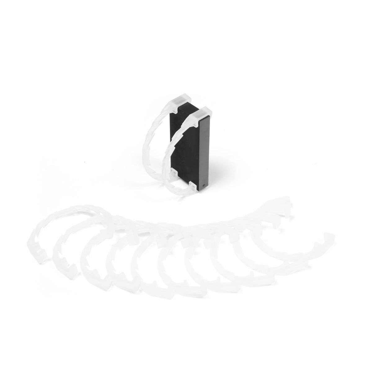 Bulk Dominoes Domino Arcs in white, 12 interlocking chain reaction clips spread in a fan with two clipped onto a black Pro Domino showing how they attach