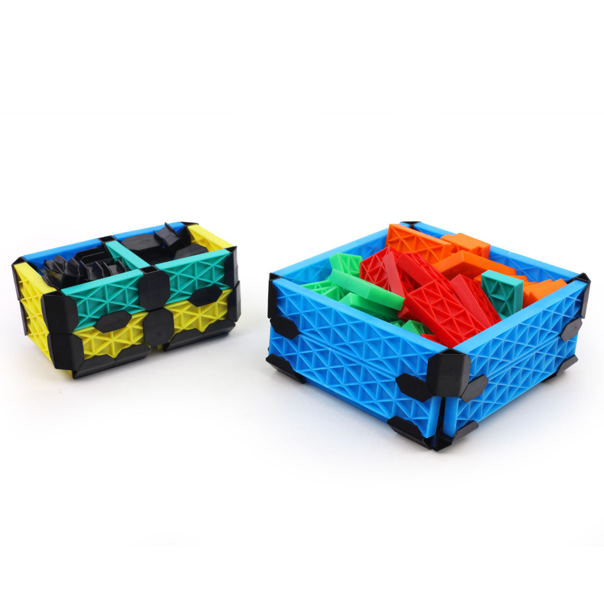 Two storage boxes built from the Atwood Toys Constructix Creative Explorer set, one in blue holding loose colorful pieces and one in yellow and teal, showing real-world organizational uses