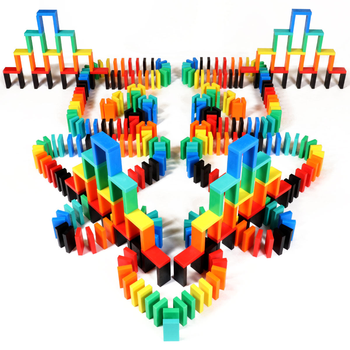 Symmetrical multicolor build from the Bulk Dominoes Expert Kit featuring rainbow Pro Dominoes arranged in towers and walls, demonstrating classic domino setup techniques.