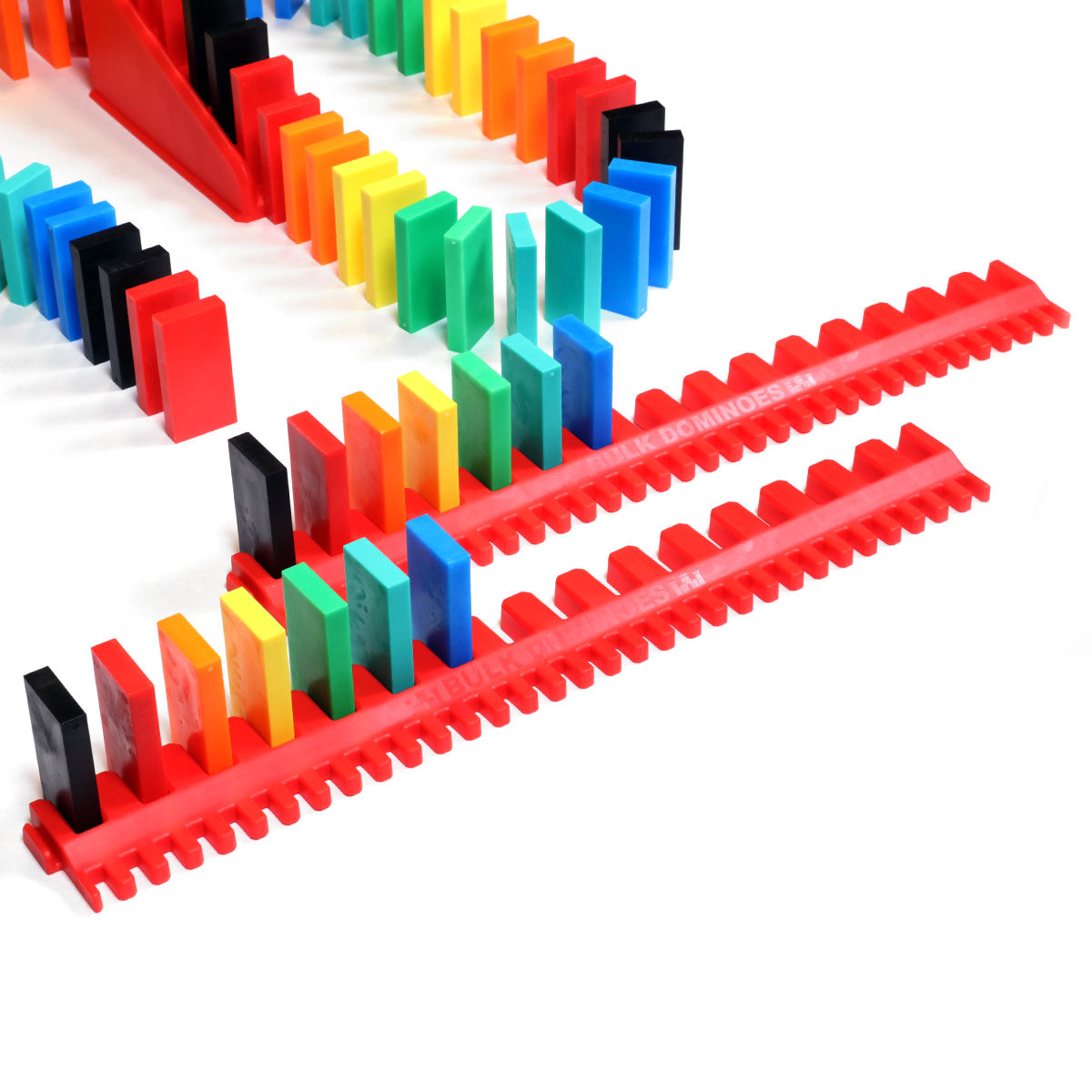 Red kinetic speed templates from the Bulk Dominoes Expert Kit holding rainbow Pro Dominoes in straight rows, designed for fast domino setups from Atwood Toys.