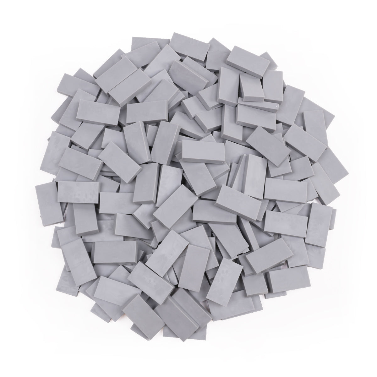Bulk Dominoes Grey Pro Dominoes from Atwood Toys, a top-down pile of solid light grey full-weight toppling dominoes for chain reactions and domino art.