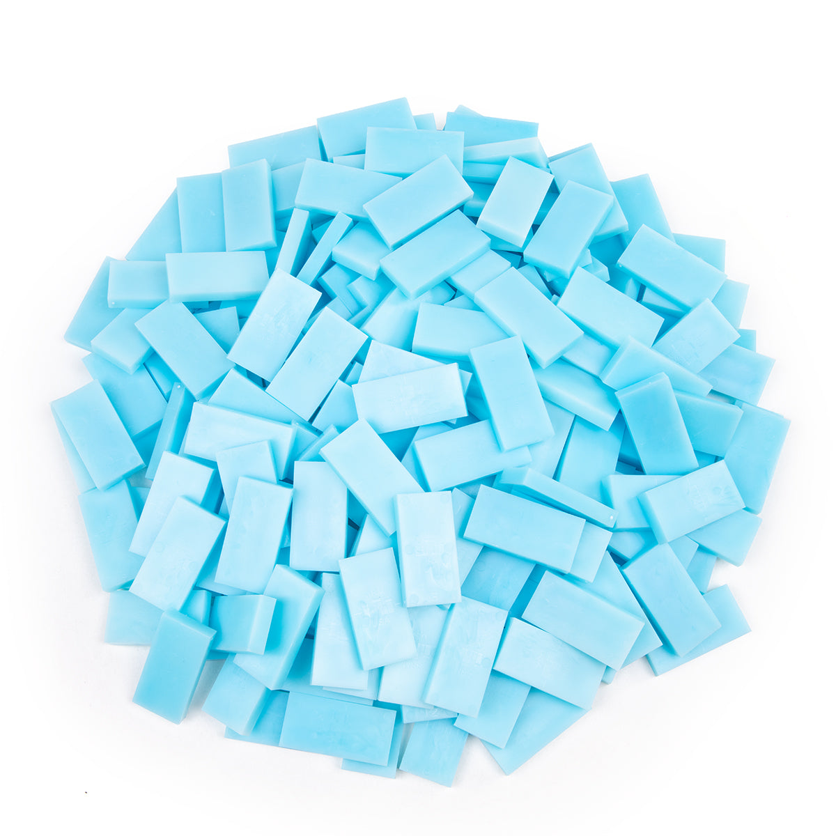Bulk Dominoes Ice Pro Dominoes from Atwood Toys, a top-down pile of light icy blue full-weight toppling dominoes for chain reactions and domino art.