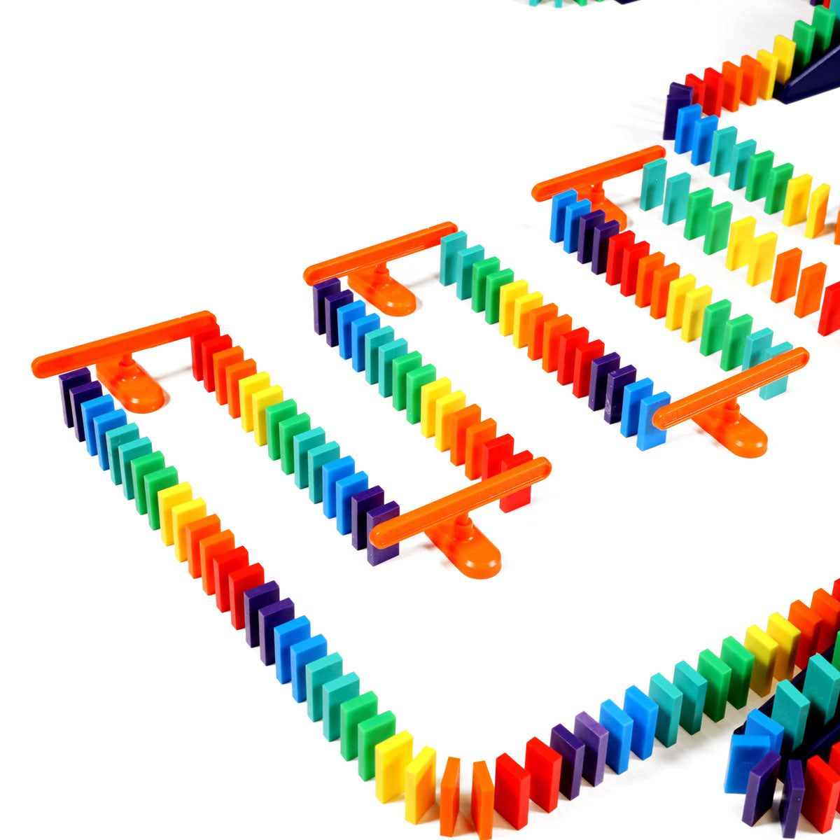 Bulk Dominoes Mini Master Kit spinners holding rainbow Mini Dominoes in a row, demonstrating advanced spinner accessory setups for chain reactions.