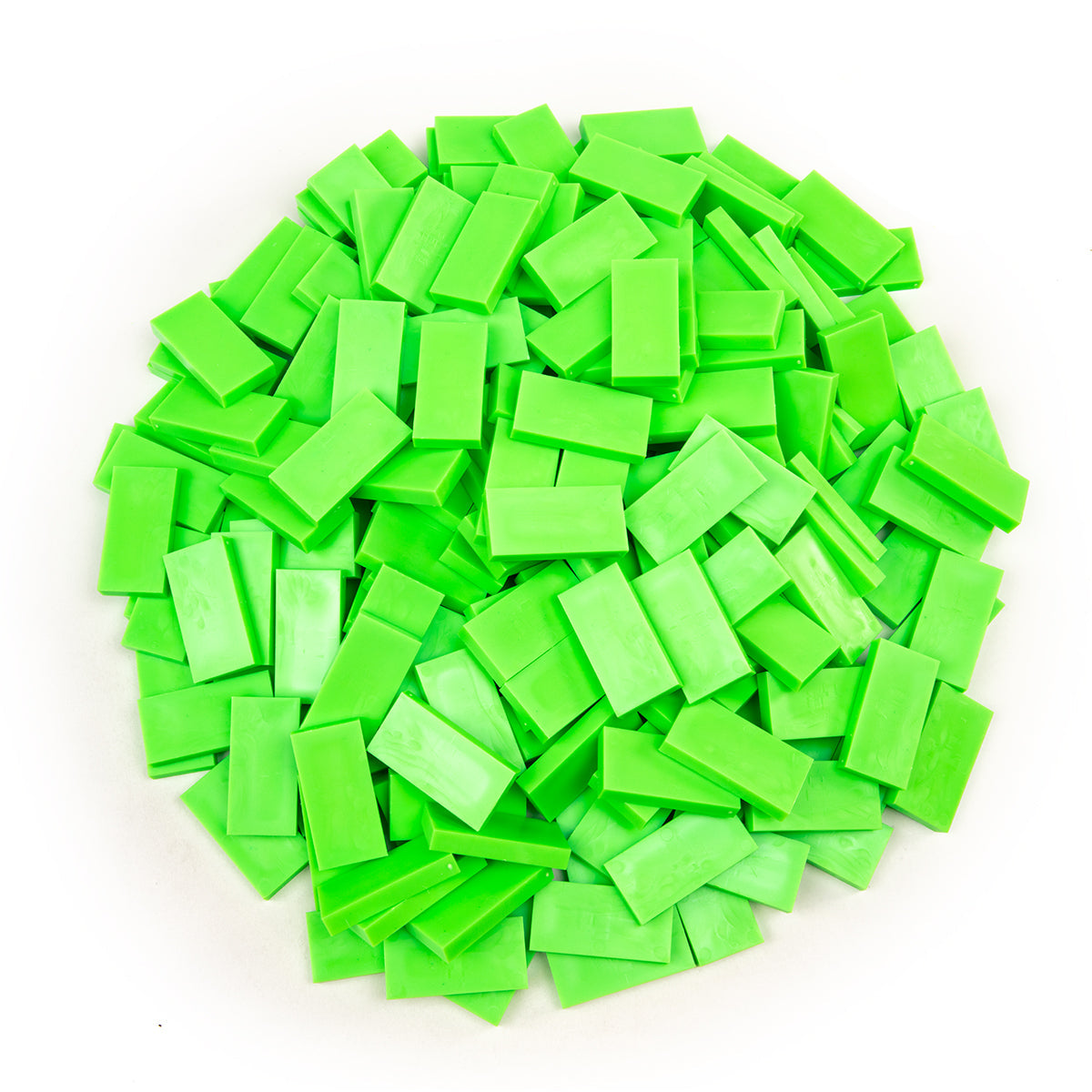 Bulk Dominoes Neon Green Pro Dominoes from Atwood Toys, a top-down pile of bright lime neon green full-weight toppling dominoes for chain reactions and domino art.