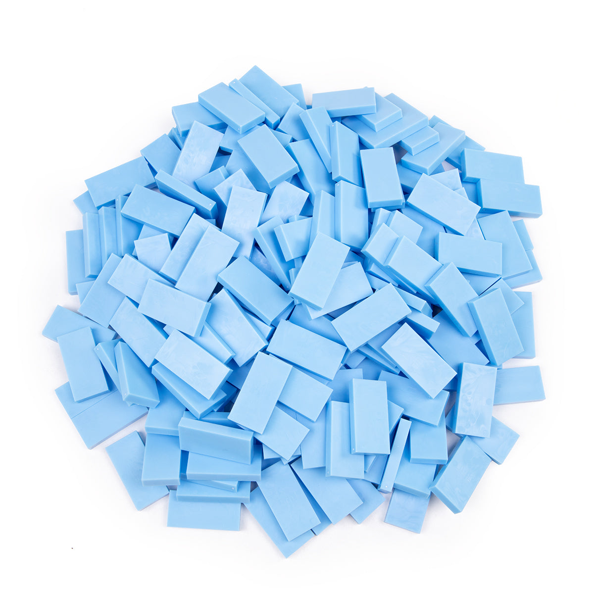 Bulk Dominoes Powder Blue Pro Dominoes from Atwood Toys, a pile of light blue full-weight toppling dominoes for chain reactions and domino art.