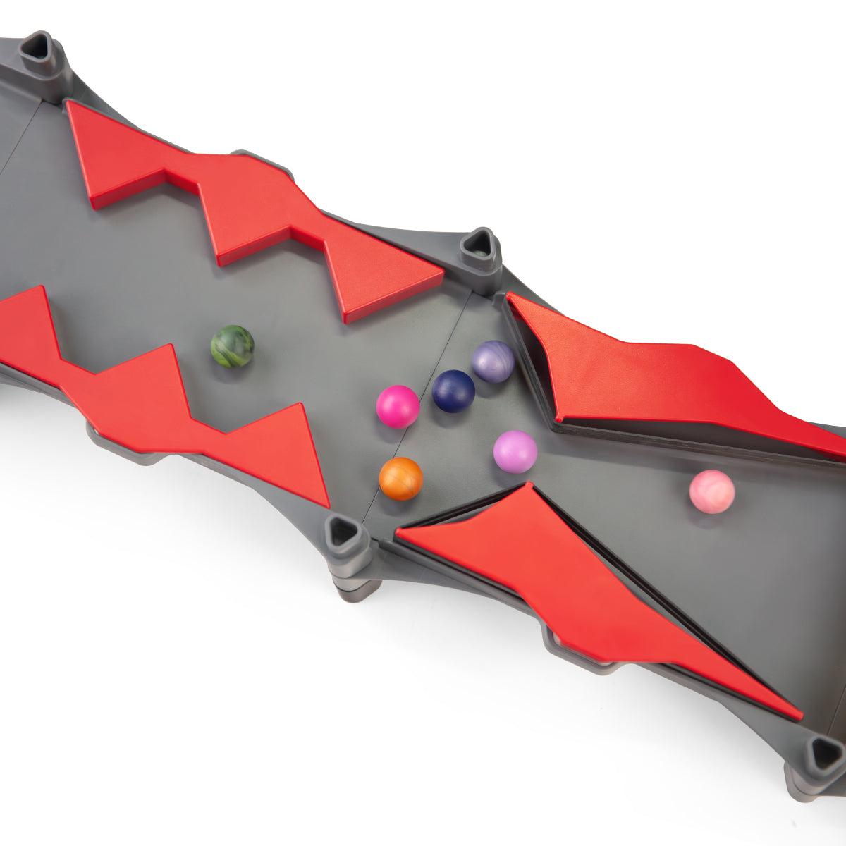 IMR Speedway Redline close-up of red zigzag bumper track section with colorful marbles bouncing between hazard walls