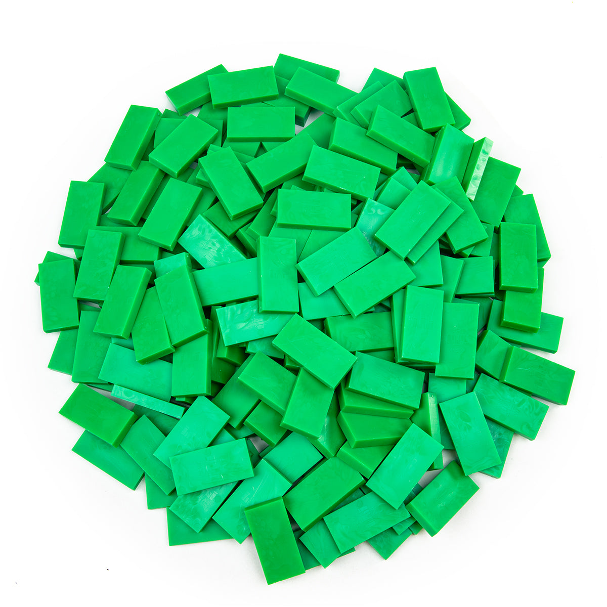 Bulk Dominoes Spring Green Pro Dominoes from Atwood Toys, a top-down pile of fresh spring green full-weight toppling dominoes for chain reactions and domino art.