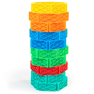 Cylindrical tower built from yellow, orange, blue, green, red, and teal Bulk Dominoes Kinetic Dominoes, demonstrating circular 3D structures from the Starter Kit 101.