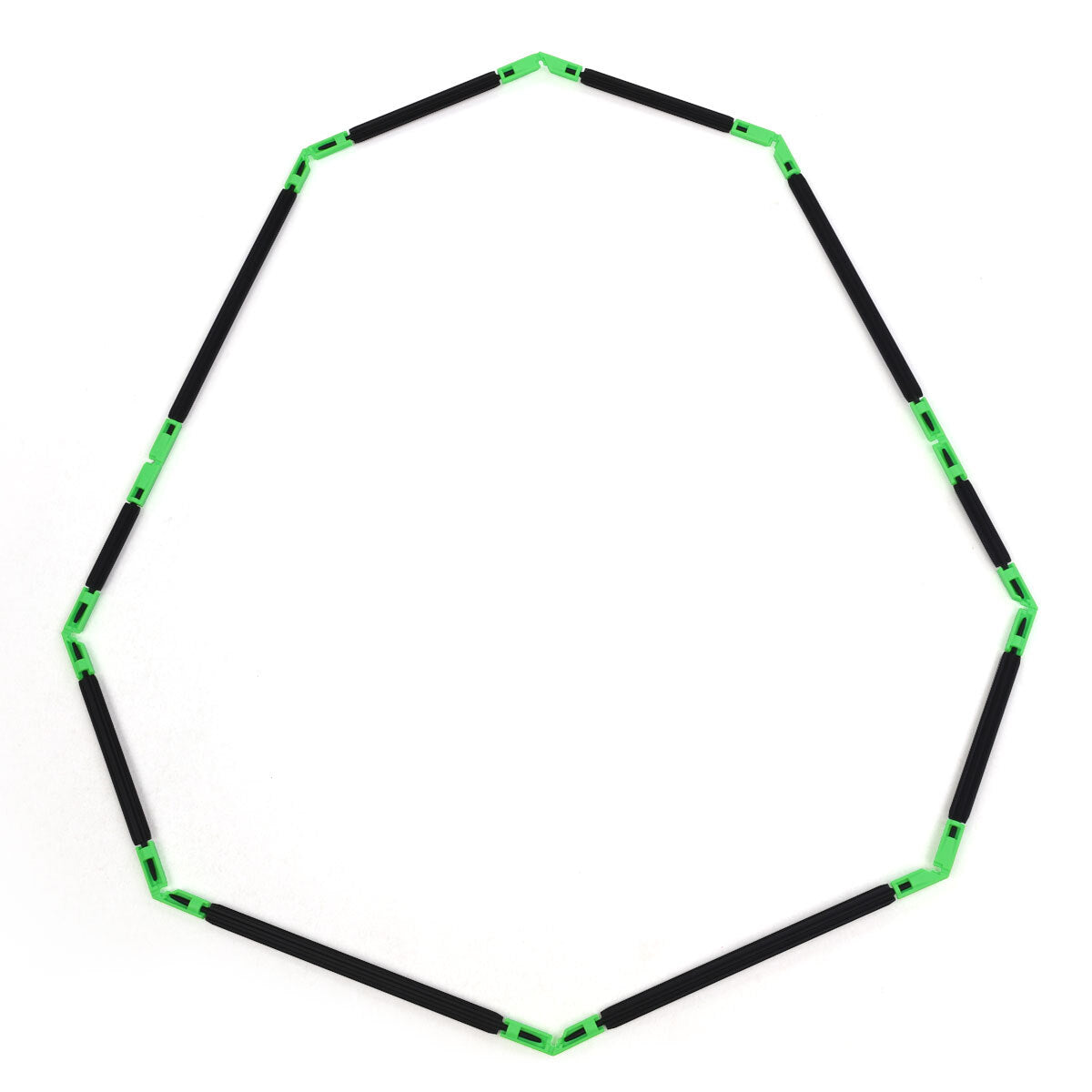 A large flat polygon shape or egg built with Inventix, laid flat to demonstrate basic 2D geometric construction using black rods connected end-to-end by green angle connectors at each vertex.