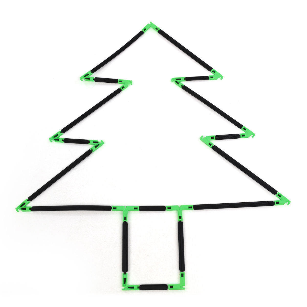 A flat 2D Christmas tree outline built with Inventix, showing three tiered triangular layers that step inward from bottom to top with a small rectangular trunk at the base, made from black rods and green angle connectors laid flat on a surface.
