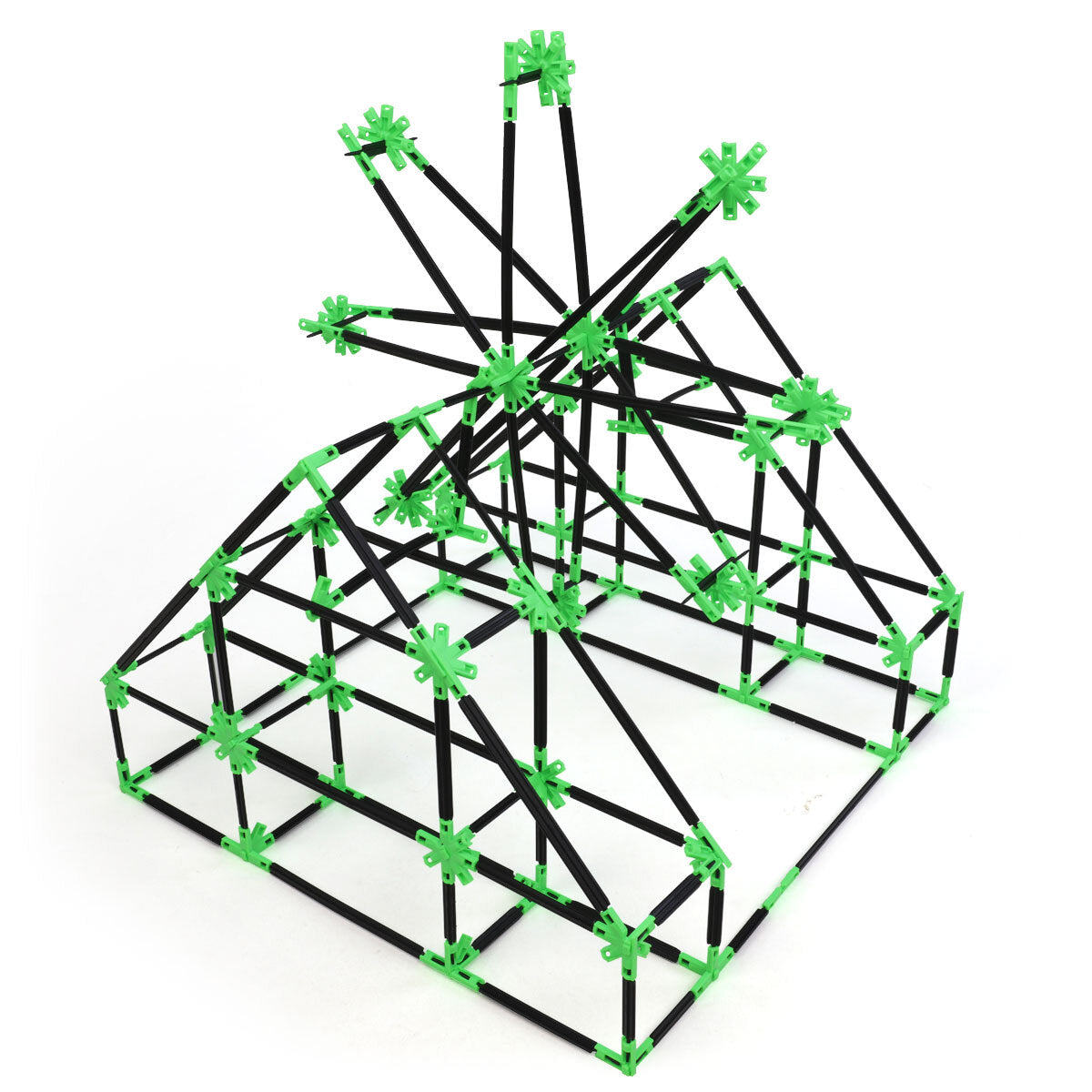 A barn structure with a windmill built with Inventix, showing a rectangular base with an arched roof and decorative radiating rods at the peak, constructed from black rods connected by green clips.