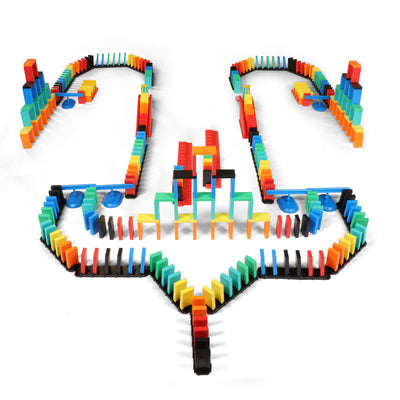 Atwood Toys Bulk Dominoes Rapid Track Kit wide shot of an elaborate symmetrical chain reaction setup with multi-color dominoes, Rapid Tracks, Domino Arcs, and spinners