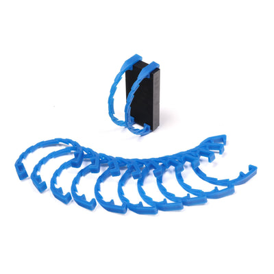 Bulk Dominoes Domino Arcs in clear transparent, 12 interlocking chain reaction clips spread in a fan with two clipped onto a black Pro Domino showing how they attach