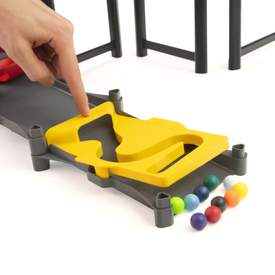 IMR Circuit Redline finish line piece with hand pressing trap door and colorful marbles lined up below