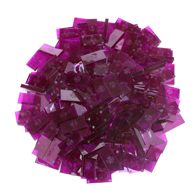 Bulk Dominoes Clear Purple Pro Dominoes from Atwood Toys, a top-down pile of translucent purple full-weight toppling dominoes for chain reactions and domino art.