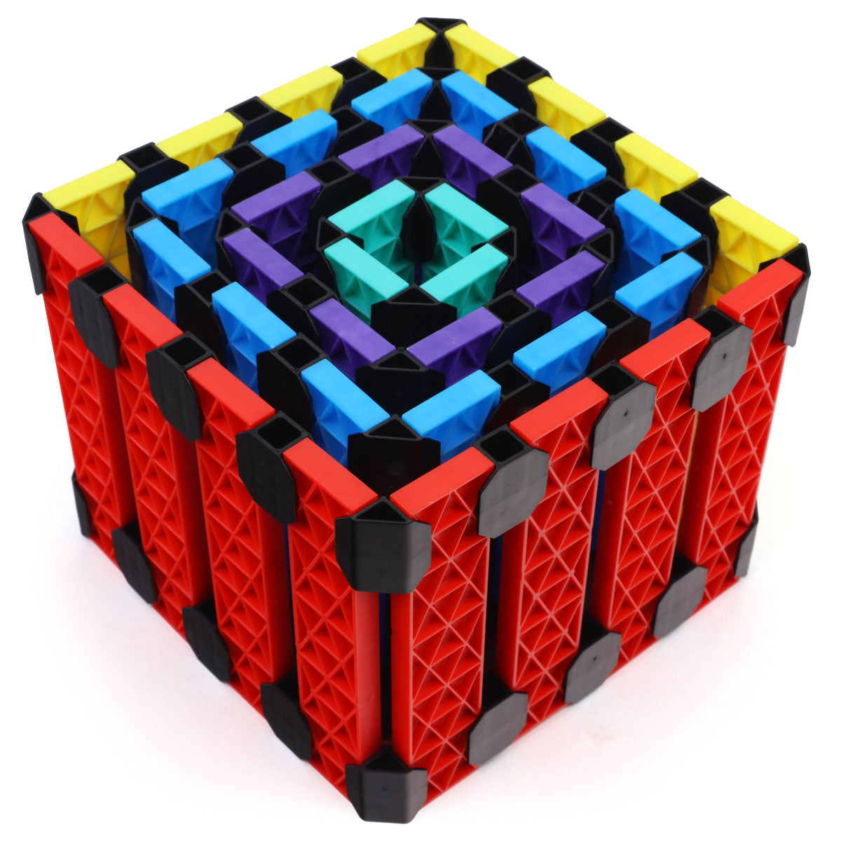 Multilayered cube built from Atwood Toys Constructix Creative Explorer clips and planks in red, blue, yellow, purple, and teal, showcasing complex 3D construction possibilities