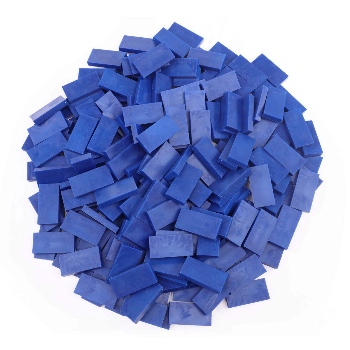 Bulk Dominoes Dark Blue Pro Dominoes from Atwood Toys, a top-down pile of solid dark blue full-weight toppling dominoes for chain reactions and domino art.