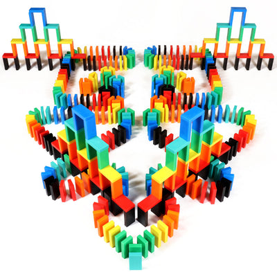 Symmetrical multicolor build from the Bulk Dominoes Expert Kit featuring rainbow Pro Dominoes arranged in towers and walls, demonstrating classic domino setup techniques.