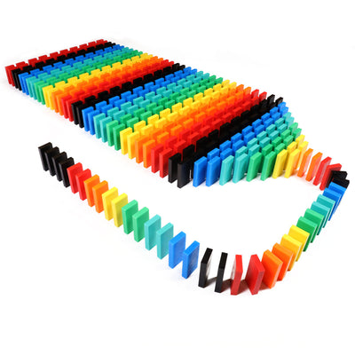 Bulk Dominoes Expert Kit Pro Dominoes arranged in a rainbow field setup, ready for chain reaction toppling, with curved domino lines from Atwood Toys.