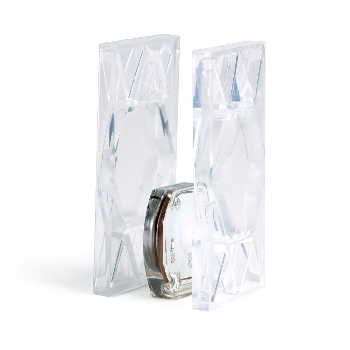 Two clear Light Up Electro Domino halves opened to reveal the internal LED light module and replaceable battery from Atwood Toys.