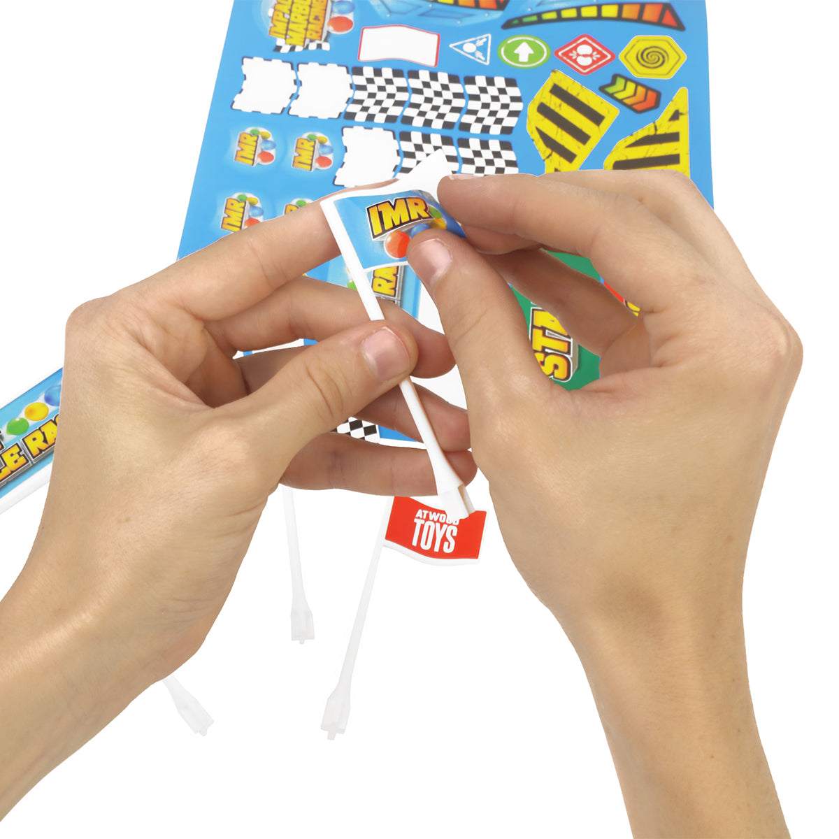 Hands applying Impact Marble Racing sticker to white flag pole from the Flags and Banners add-on pack
