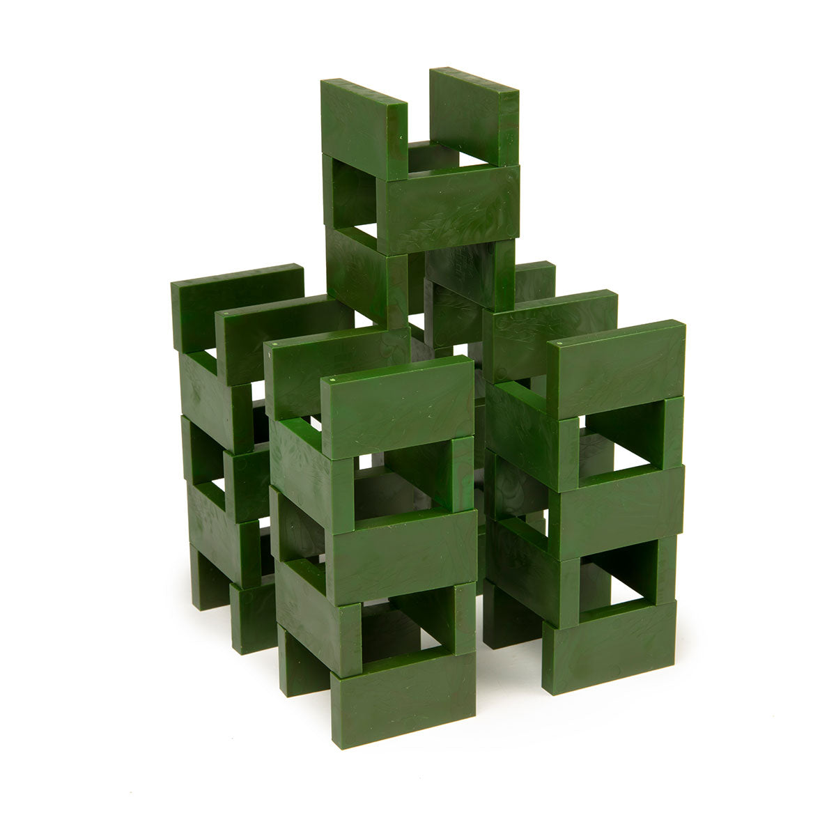 Bulk Dominoes Forest Green Pro Dominoes from Atwood Toys stacked into an open log-cabin style tower structure of interlocking green dominoes.