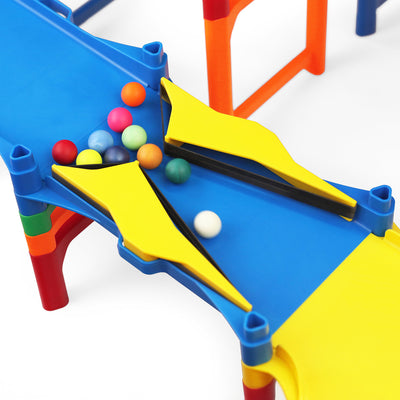 IMR Grand Prix Overdrive close-up of yellow bumper track piece on blue lane with colorful marbles funneling through