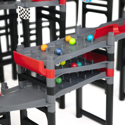 IMR Grand Prix Redline close-up of multi-level impact zone peg sections with colorful marbles racing across stacked gray lanes and red dividers