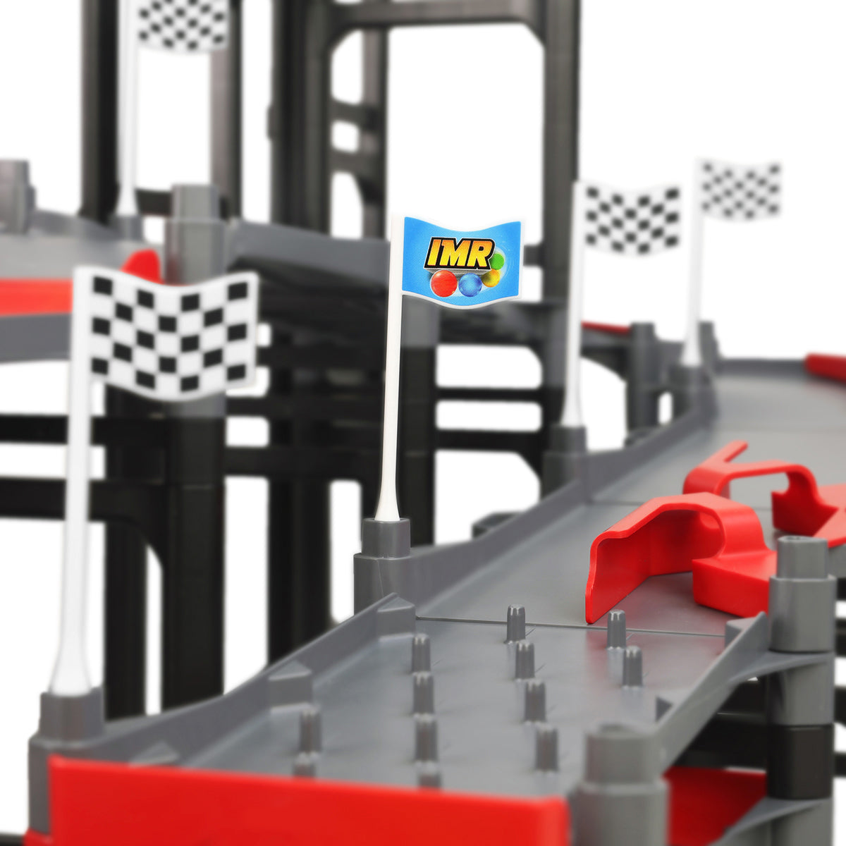 IMR Grand Prix Redline close-up of Impact Marble Racing branded flag and checkered race flags mounted along gray track with red bumper sections and support structure in background