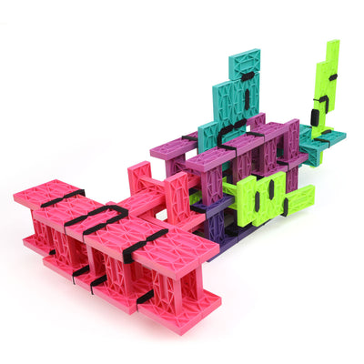 Hammerhead shark built from pink, purple, teal, green, and lime Blokix interlocking building blocks, an open-ended STEAM building toy from Atwood Toys
