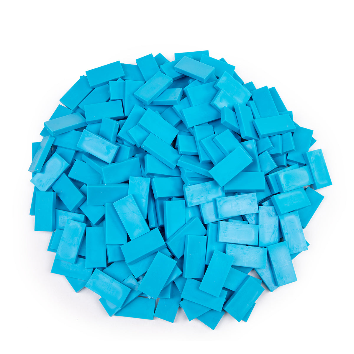 Bulk Dominoes Island Blue Pro Dominoes from Atwood Toys, a pile of ocean blue full-weight toppling dominoes for chain reactions and domino art.