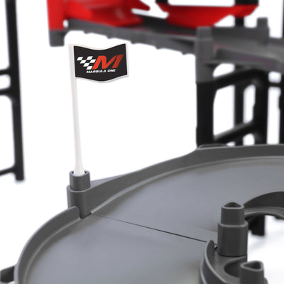 Jelle's M1 Hyper Loop close-up of Marbula One branded flag mounted on gray track section with red bumper and black support structure in background