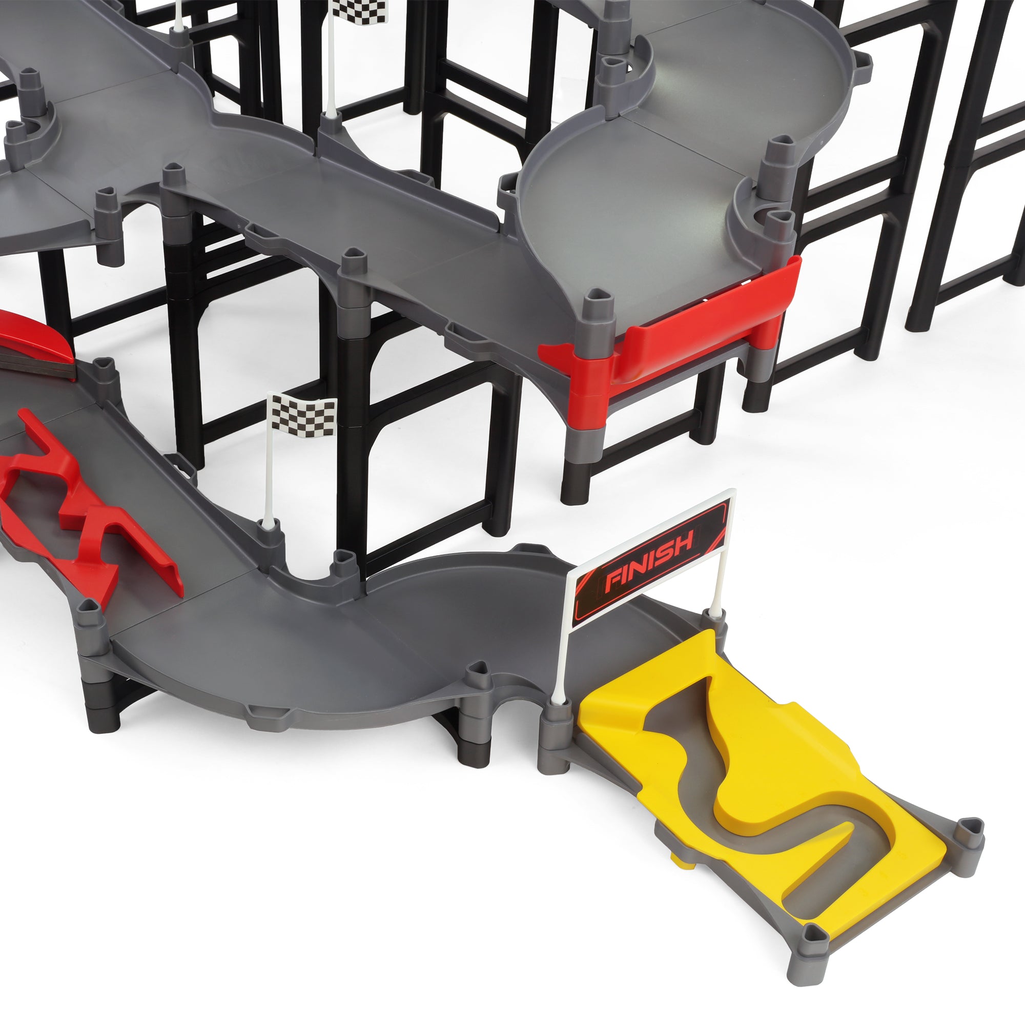 Jelle's M1 Hyper Loop medium shot showing multi-level gray track with curved turnback sections, red bumper pieces, checkered flags, and yellow finish line gate at the base