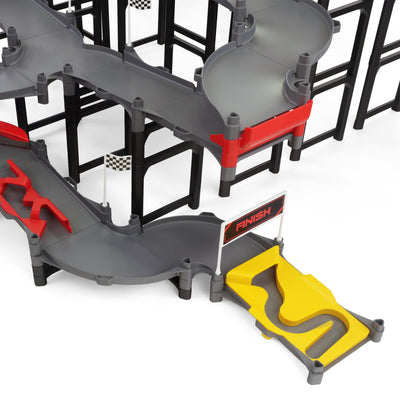 Jelle's M1 Hyper Loop medium shot showing multi-level gray track with curved turnback sections, red bumper pieces, checkered flags, and yellow finish line gate at the base