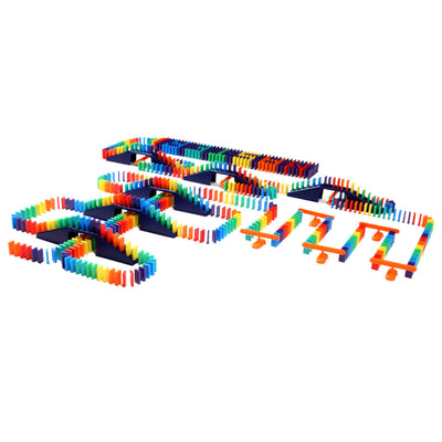 Wide angled view of the Bulk Dominoes Mini Master Kit from Atwood Toys with rainbow Mini Dominoes arranged across navy blue bridges, ramps, and orange accessory pieces.