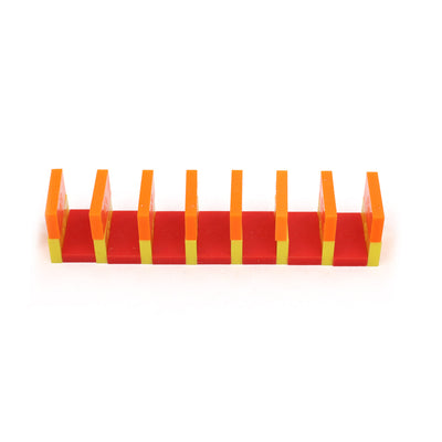 Column build technique using red, orange, and yellow Bulk Dominoes Mini Dominoes from the Mini Master Kit, demonstrating advanced stacking.