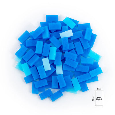 Atwood Toys World Record Mini Micro Dominoes blue toppling dominoes piled together with 5mm by 10mm size reference showing 80X smaller scale than standard dominoes