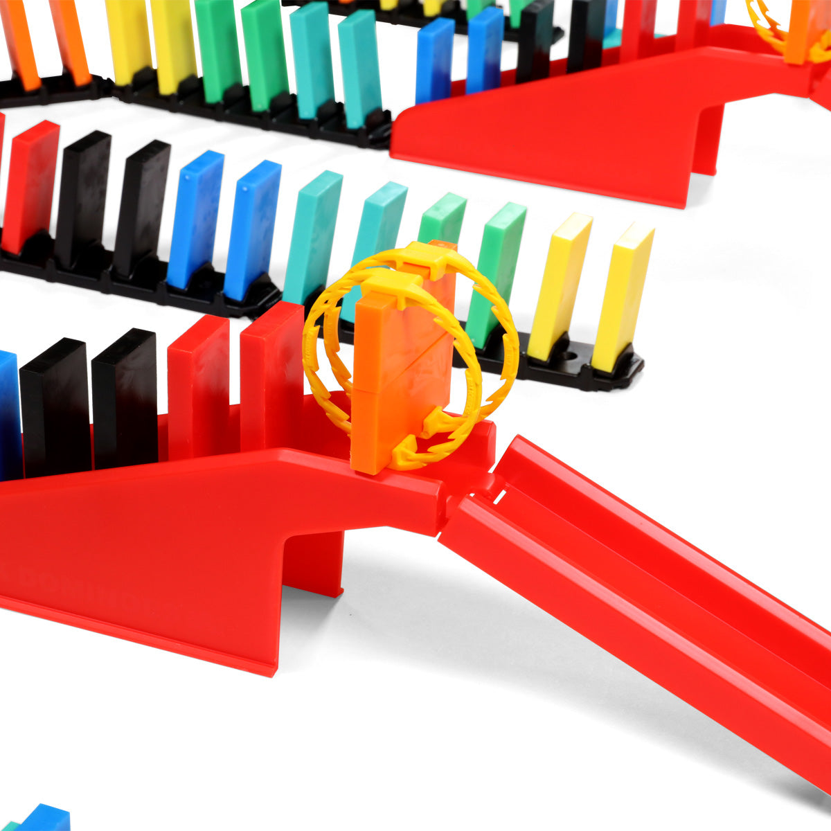 Atwood Toys Bulk Dominoes Rapid Track Kit close-up of a red Staircase Bridge with yellow rolling Domino Arc and multi-color dominoes locked into black Rapid Track bases