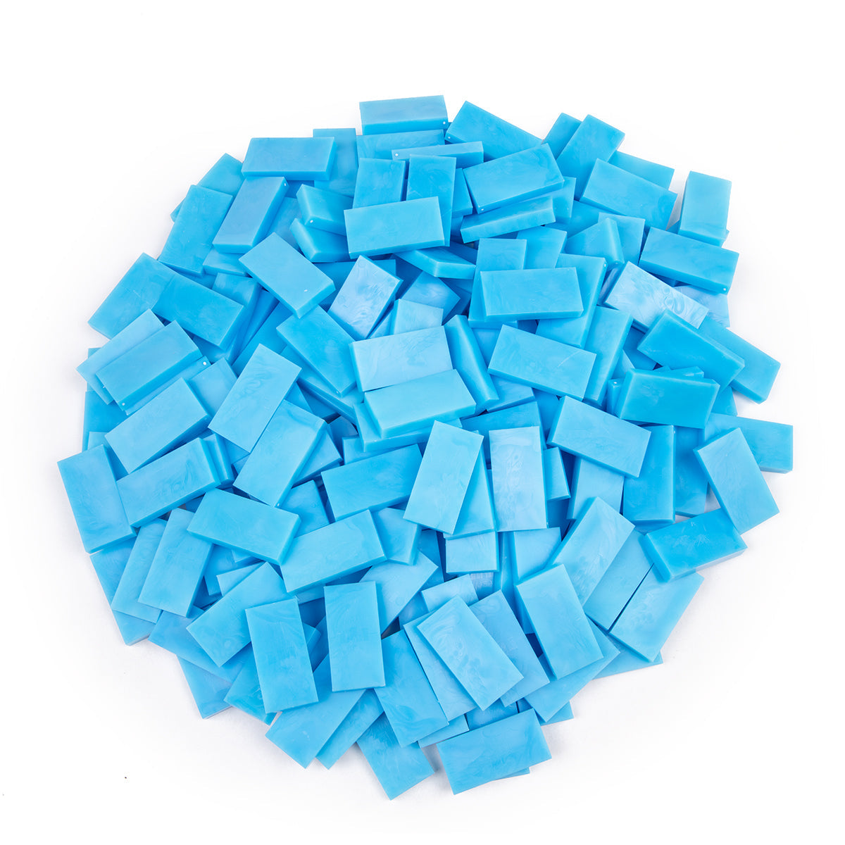 Bulk Dominoes Sky Blue Pro Dominoes from Atwood Toys, a pile of sky blue full-weight toppling dominoes for chain reactions and domino art.