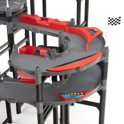 IMR Speedway Redline spiral turn close-up showing multi-level curved descent with red lane dividers and checkered flag