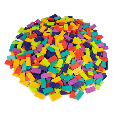 Atwood Toys Bulk Dominoes Inertia Mix, multi-color toppling dominoes in raspberry, indigo, teal, sour apple, gold, and lava orange piled together for stacking, toppling, and domino art