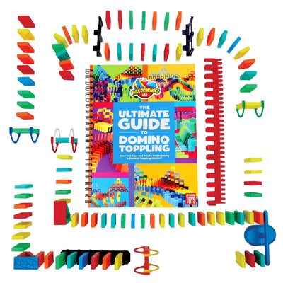 Top-down view of the Bulk Dominoes Ultimate Starter Kit 101 from Atwood Toys, showing rainbow Kinetic Dominoes, accessories, kinetic speed template, and the Ultimate Guide to Domino Toppling book.