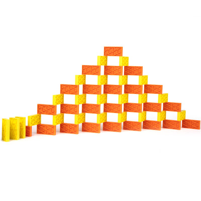 Bulk Dominoes Kinetic Dominoes built into a 3D pyramid wall using yellow and orange dominoes, demonstrating advanced domino toppling structures from the Ultimate Starter Kit 101.