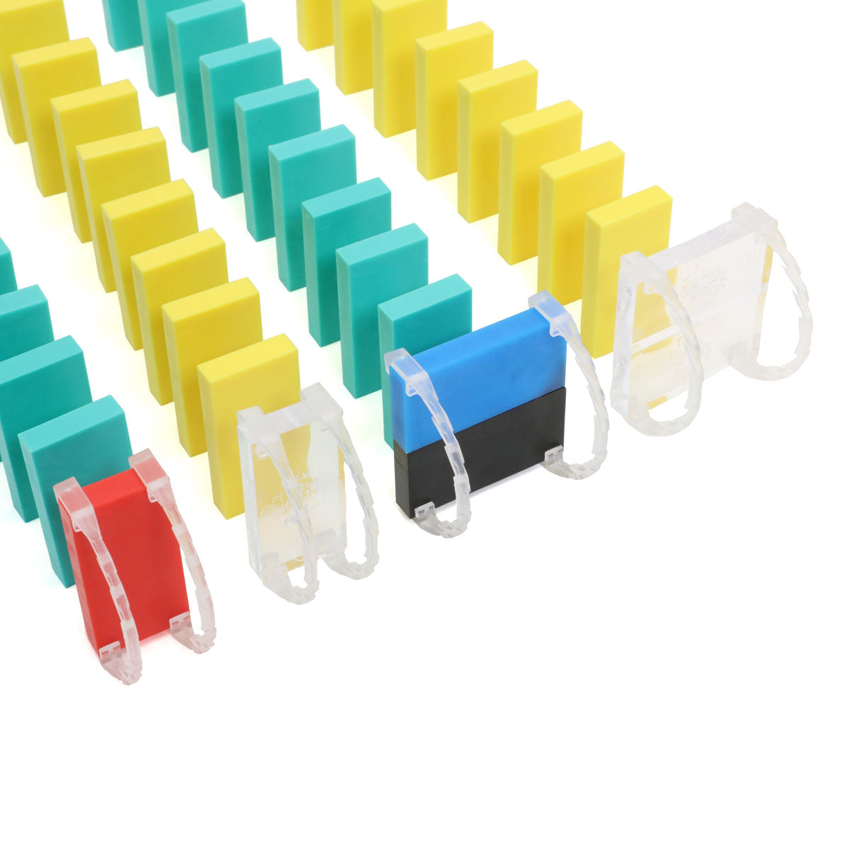 Bulk Dominoes clear Domino Arcs clipped onto colorful Pro Dominoes in a chain reaction setup with yellow, teal, red, and blue dominoes lined up on black rapid track
