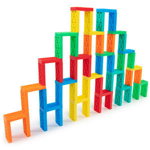 Multicolor Bulk Dominoes Kinetic Dominoes stacked into intricate 3D towers and bridges, demonstrating tower-building techniques from the Ultimate Guide to Domino Toppling.