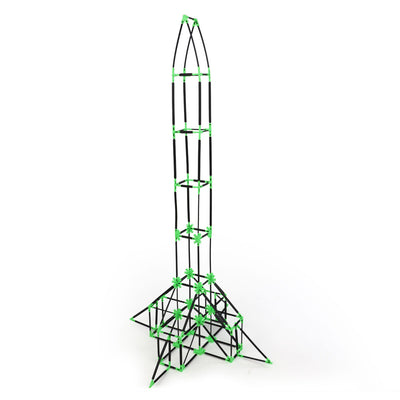 An Eiffel Tower built with Inventix, featuring a wide pyramidal base with cross-bracing, a narrow tapered midsection with internal framework, and a pointed top with curved rods forming the iconic tower silhouette, made from black rods and green star connectors.
