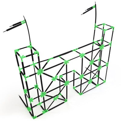A castle gate built with Inventix, featuring two tall rectangular towers with flag-like rods at the top, connected by an arched bridge section with diagonal cross-bracing throughout.